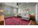 Spacious living room with hardwood floors, a modern sectional, and ample natural light from large windows at 2234 Kemmerlin St, Johns Island, SC 29455