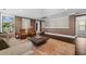 Spacious living area featuring a sofa, modern coffee table, and plenty of natural light from the surrounding windows at 2234 Kemmerlin St, Johns Island, SC 29455