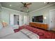 Bright living room with hardwood floors, a modern sectional, media cabinet and access to other areas at 2234 Kemmerlin St, Johns Island, SC 29455
