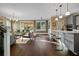 Bright open-concept living room with hardwood floors, neutral paint, and lots of natural light at 2234 Kemmerlin St, Johns Island, SC 29455