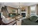 Inviting living room with cozy seating, fireplace, and natural light from the window at 2234 Kemmerlin St, Johns Island, SC 29455