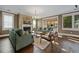 Cozy living room with a fireplace, comfortable seating, and a large window with natural light at 2234 Kemmerlin St, Johns Island, SC 29455