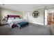 Stylish main bedroom with a plush bed, upholstered bench, and a decorative mirror at 2234 Kemmerlin St, Johns Island, SC 29455