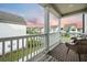Inviting porch features a seating area with views of the neighborhood and sunset at 2234 Kemmerlin St, Johns Island, SC 29455