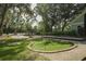 A fun putting green with a playground beyond provides entertainment for the whole Gathering at 2234 Kemmerlin St, Johns Island, SC 29455