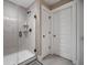 Modern shower featuring glass doors, sleek fixtures, and marble-look tile at 2234 Kemmerlin St, Johns Island, SC 29455