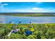 An aerial view of a waterside home surrounded by lush trees and natural beauty at 2287 Shoreline Dr, Johns Island, SC 29455