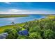An aerial shot shows a neighborhood home with the scenic waterway in the background at 2287 Shoreline Dr, Johns Island, SC 29455