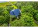 An aerial view shows a marsh-side home surrounded by lush green trees and nature at 2287 Shoreline Dr, Johns Island, SC 29455