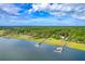 Gorgeous aerial perspective of upscale waterfront properties, private docks, and abundant natural beauty at 2287 Shoreline Dr, Johns Island, SC 29455