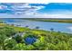 An aerial view captures a neighborhood with a view of the marsh and waterfront at 2287 Shoreline Dr, Johns Island, SC 29455