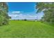 Expansive backyard leading to waterfront views and a private dock, perfect for outdoor enjoyment at 2287 Shoreline Dr, Johns Island, SC 29455