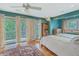 Bright bedroom features an exit to a balcony and well-appointed furniture at 2287 Shoreline Dr, Johns Island, SC 29455