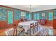 Elegant dining room features wainscoting, detailed wallpaper, and a chandelier at 2287 Shoreline Dr, Johns Island, SC 29455