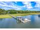 Waterfront property boasting a private dock and boat lift, perfect for boating and enjoying serene water views at 2287 Shoreline Dr, Johns Island, SC 29455
