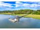 Picturesque waterfront with a private dock and boat lift, perfect for enjoying serene water activities at 2287 Shoreline Dr, Johns Island, SC 29455