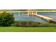 A serene view of a dock leading to a charming gazebo and a beautiful waterfront at 2287 Shoreline Dr, Johns Island, SC 29455