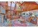 Inviting living room featuring a brick fireplace, wood-paneled walls, and vaulted ceilings at 2287 Shoreline Dr, Johns Island, SC 29455