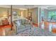 Spacious main bedroom features a sitting area, wood floors, and ample natural light at 2287 Shoreline Dr, Johns Island, SC 29455
