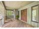 Inviting front porch featuring a wood door, wood flooring and lots of space to relax at 2287 Shoreline Dr, Johns Island, SC 29455