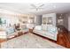 Spacious living room connects to dining and kitchen with hardwood floors and bright decor at 2517 Charter Oaks Dr, Mount Pleasant, SC 29466