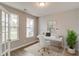 Bright home office with a modern desk, comfortable chair, and natural light from the windows at 2703 Grange Cir, Summerville, SC 29486