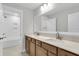 Modern bathroom with dual sinks, neutral tiling, and recessed lighting at 2807 Grange Cir, Summerville, SC 29486