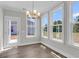 Sunlit dining area with large windows and backyard access at 2807 Grange Cir, Summerville, SC 29486