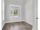 Bright foyer featuring hardwood floors and a glass-paneled front door at 2807 Grange Cir, Summerville, SC 29486