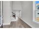 Spacious entryway with hardwood floors, leading to a staircase and living area at 2807 Grange Cir, Summerville, SC 29486