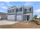 Two-story home with a three-car garage and a well-maintained front yard at 2807 Grange Cir, Summerville, SC 29486