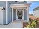 Inviting entryway with sidelights, white columns, and address number at 2807 Grange Cir, Summerville, SC 29486