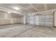 A spacious three-car garage featuring high ceilings and a concrete floor at 2807 Grange Cir, Summerville, SC 29486