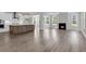 Open-concept living space with a fireplace, island kitchen, and natural light at 2807 Grange Cir, Summerville, SC 29486