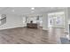 Open living space with hardwood floors, a fireplace, and an island kitchen at 2807 Grange Cir, Summerville, SC 29486
