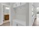 Mudroom with built-in storage, access to the powder room, and view into kitchen at 2807 Grange Cir, Summerville, SC 29486