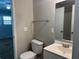 Cozy bathroom with neutral walls, toilet, sink, and vanity, complemented by a chrome towel rack at 2827 Haverhill Cir, North Charleston, SC 29420