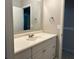 Bright bathroom with a clean white vanity, framed mirror, and modern fixtures providing ample storage at 2827 Haverhill Cir, North Charleston, SC 29420
