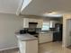 Updated kitchen with white cabinetry, sleek appliances, and a functional layout perfect for cooking and entertaining at 2827 Haverhill Cir, North Charleston, SC 29420