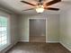 Neutral-toned living area with a large window and seamless transition to a tiled dining room at 2827 Haverhill Cir, North Charleston, SC 29420
