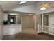 Inviting living room with vaulted ceilings, skylight and a seamless transition to the tiled kitchen area at 2827 Haverhill Cir, North Charleston, SC 29420