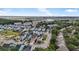 Aerial view of a coastal community with colorful homes near marsh and beaches at 307 Morning Marsh Ln, Charleston, SC 29492