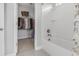 Bathroom with tub, shower, tile flooring, and access to the walk-in closet at 307 Morning Marsh Ln, Charleston, SC 29492