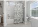 Clean bathroom features tub, shower, tile flooring, and a window, offering natural light at 307 Morning Marsh Ln, Charleston, SC 29492