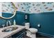 Stylish bathroom featuring fish wallpaper, a marble sink and custom vanity at 307 Morning Marsh Ln, Charleston, SC 29492