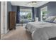 Cozy bedroom featuring a large window, desk, chair, ceiling fan and bedside lamp at 307 Morning Marsh Ln, Charleston, SC 29492
