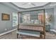 Bedroom with a canopy bed, light blue walls, and lots of natural light at 307 Morning Marsh Ln, Charleston, SC 29492
