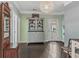 Inviting entryway featuring wood floors, a built-in shelf, and colorful walls at 307 Morning Marsh Ln, Charleston, SC 29492