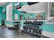 Well-equipped gym featuring weight racks, punching bag, and large mirror to enhance workout experience at 307 Morning Marsh Ln, Charleston, SC 29492