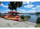 Colorful kayaks stacked near the waterfront, offering residents easy access to paddling adventures in the serene waterway at 307 Morning Marsh Ln, Charleston, SC 29492